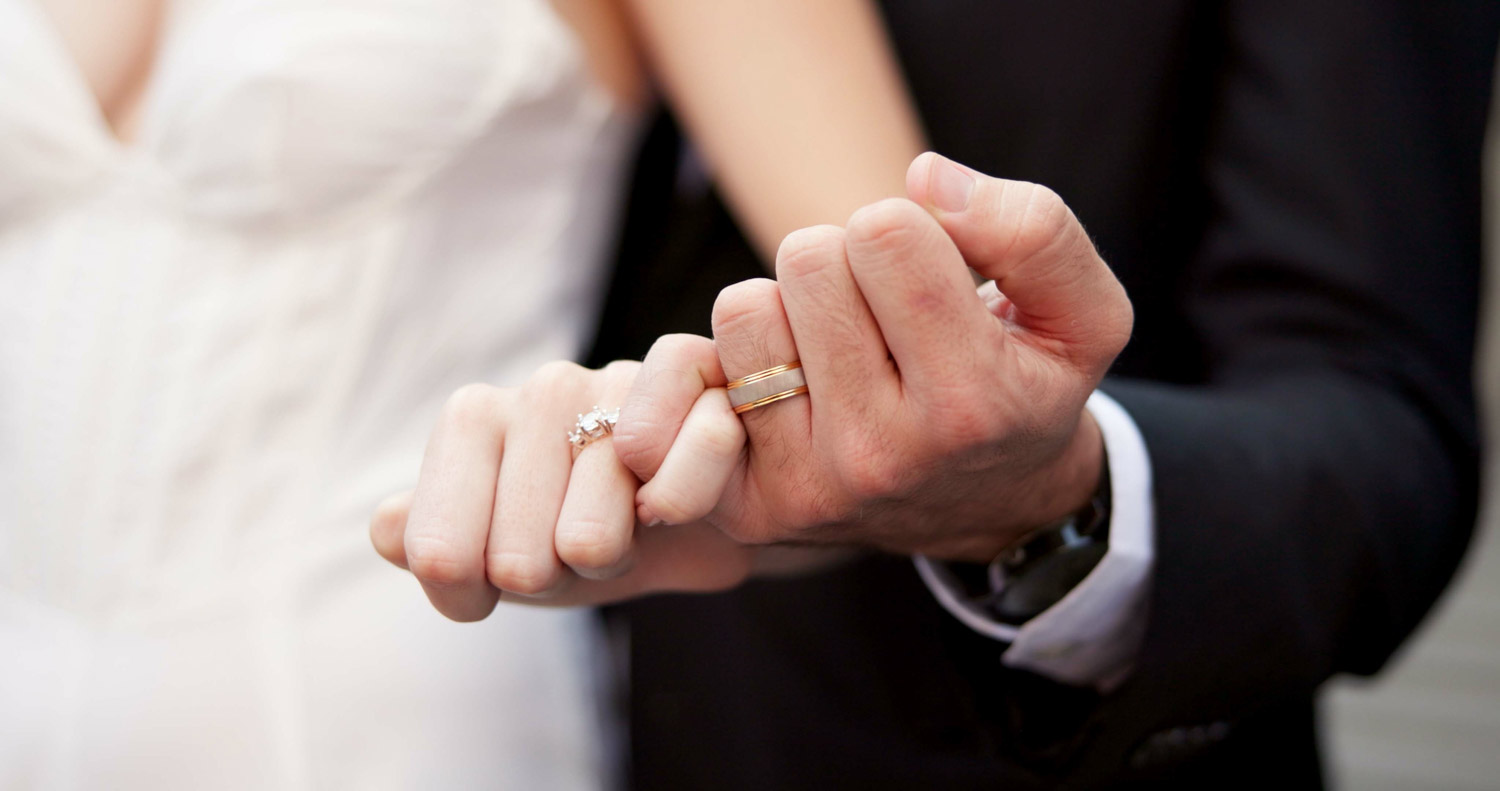 Holding hands, ring and couple on wedding with promise, celebrat